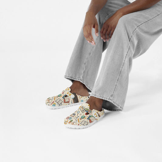 Slip-on clogs with retro classroom pattern, worn with light denim jeans