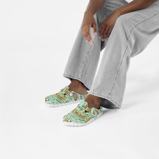 Mint printed EVA clogs worn with gray pants, front view of both shoes