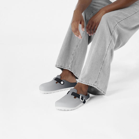 Grey slip-on EVA clogs with black strap buckles and textured outsole
