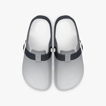 Pair of grey EVA clogs with black straps, cushioned open-back design