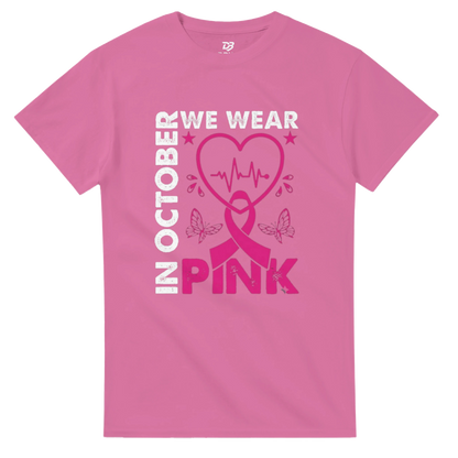Pink unisex T-shirt with 'OCTOBER WE WEAR PINK' heart ribbon graphic