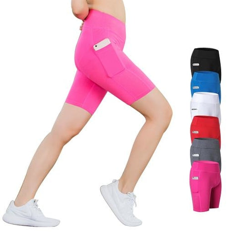Pink stretch yoga shorts with phone pocket, worn on a model, mid-thigh length.