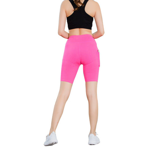 Pink stretch yoga shorts with phone pocket, worn by a model with black sports top.
