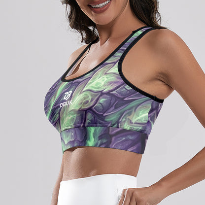 Women's cropped yoga tank top angled view, purple and green all-over print with DBUK logo