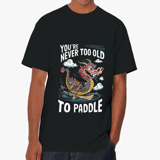 Unisex black tee with "You're Never Too Old" "To Paddle" sea monster graphic