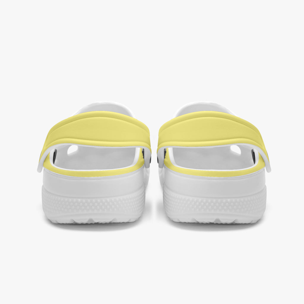 Kids yellow slip-on clogs with cartoon theme, back view showing heels and straps