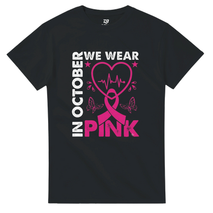 Black unisex T-shirt with 'OCTOBER WE WEAR PINK' heart ribbon graphic