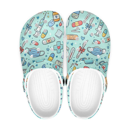 Pair of light blue clogs showing white inner sole with colorful cartoon medical print