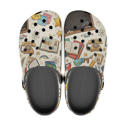 Top view of kids teacher clogs showing classroom print uppers and dark gray insoles.