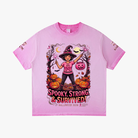 Pink Halloween graphic tee with witch, pumpkins, and “Spooky Strong & Survived!”