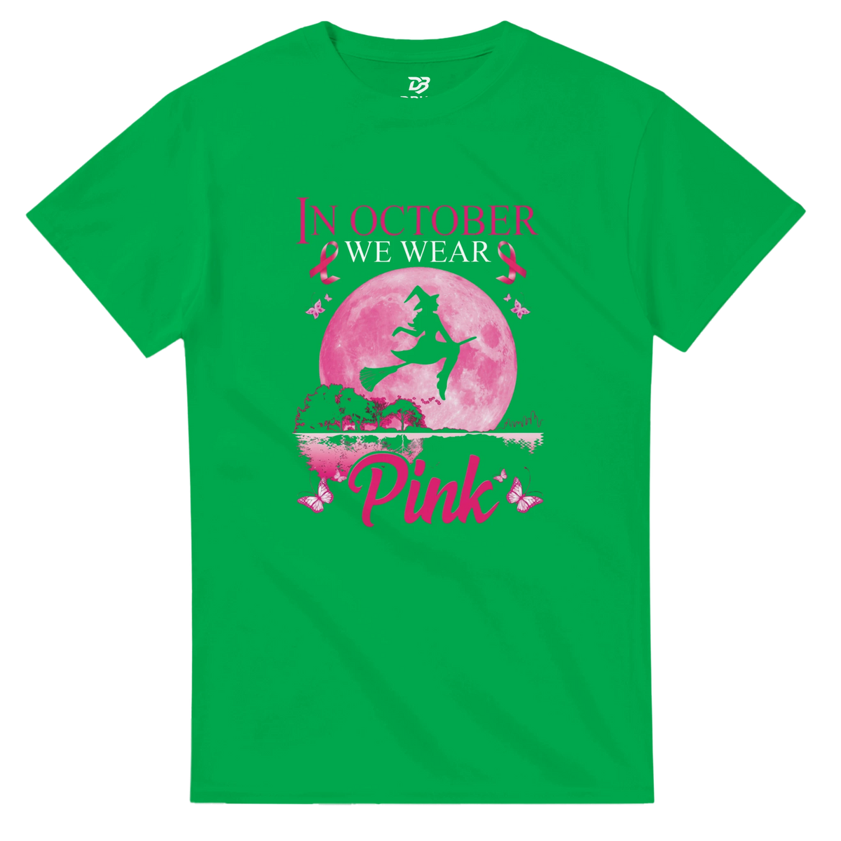 Green unisex T-shirt with pink witch-on-broom moon graphic and “Pink” ribbon text