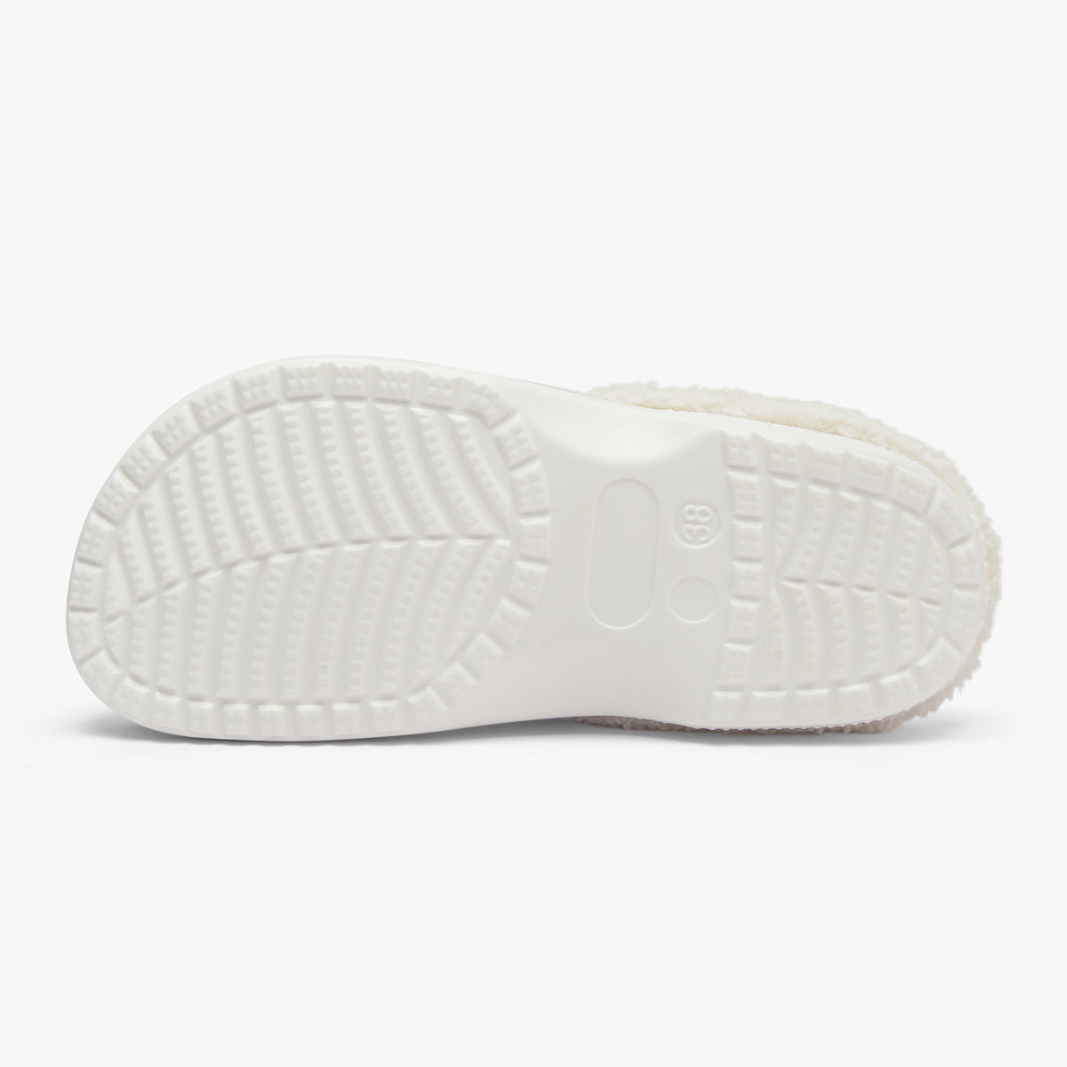White sandal sole with textured pattern on a white background