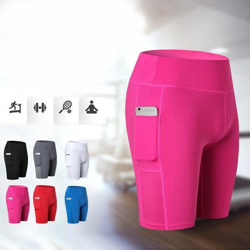 Pink stretch yoga shorts with built-in phone pocket, mid-thigh length.