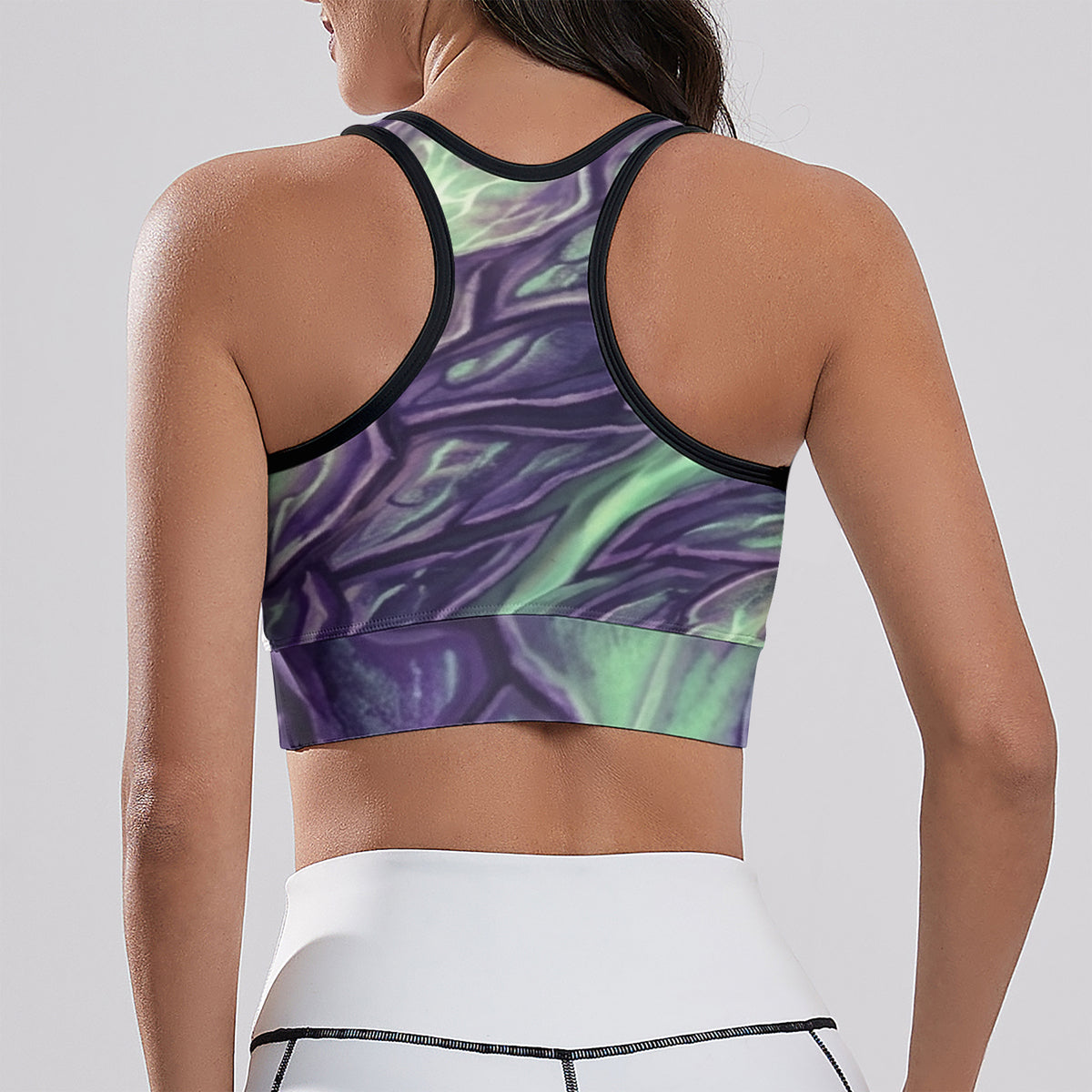 Women's cropped yoga tank top back view, purple and green print with black racerback trim