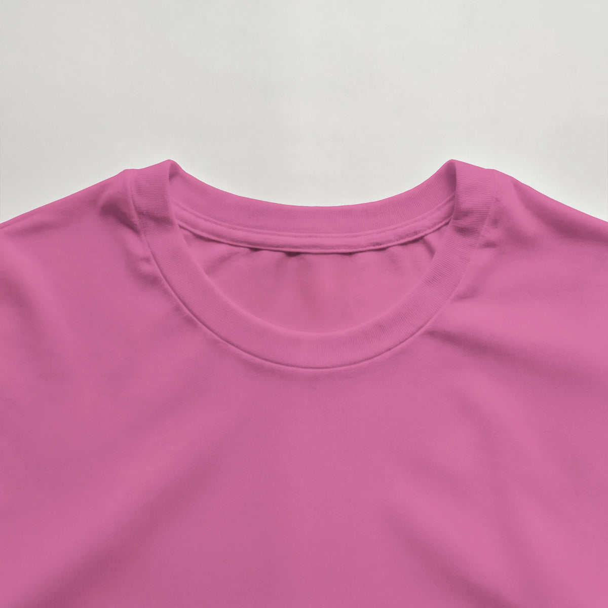 Women’s azalea crewneck T-shirt neckline close-up with small DBUK logo