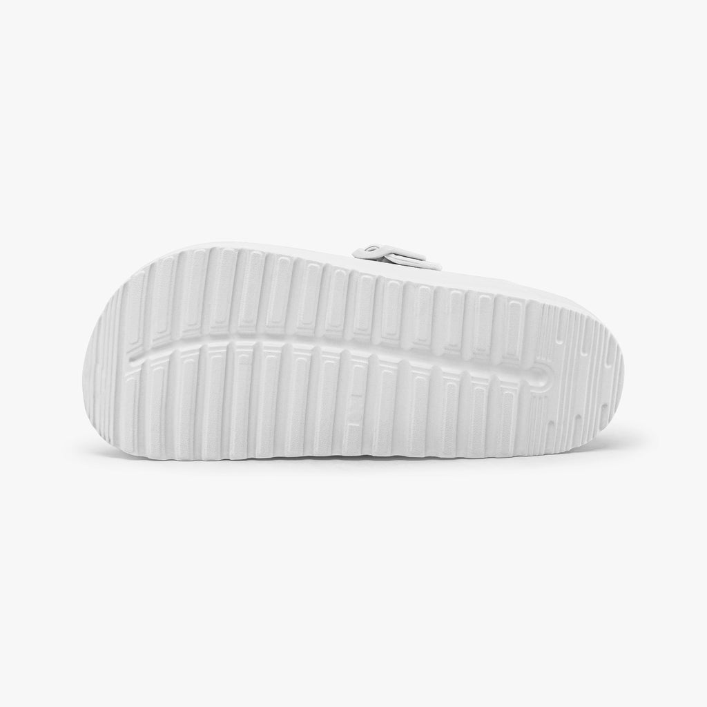 White EVA clog outsole with molded tread and heel texture
