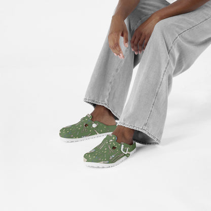 Green veterinary print EVA clogs worn with white crew socks and jeans