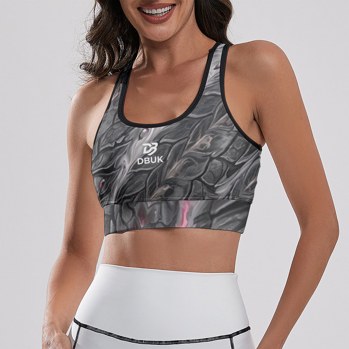 Women's cropped yoga tank top with dark grey marbled all-over print, black trim, DBUK chest logo
