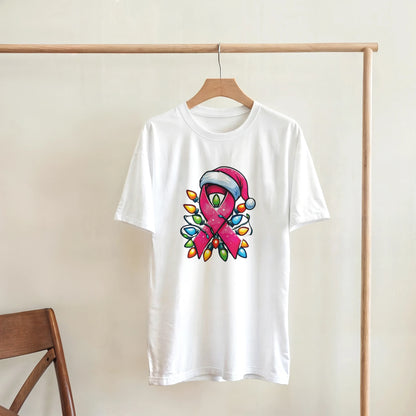 White crewneck T-shirt hanging with pink ribbon character graphic and colorful Christmas lights
