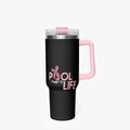 A black insulated travel tumbler with a pink handle, clear lid, and pink lid detail, featuring the text 'POOL OF LIFE' in pink on the front, set against a light gray background.