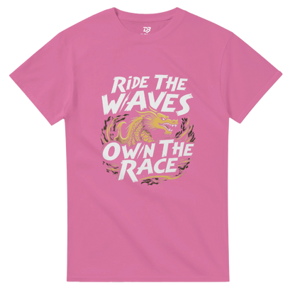 Unisex pink T-shirt with “Ride the Waves / Own the Race” dragon graphic on front