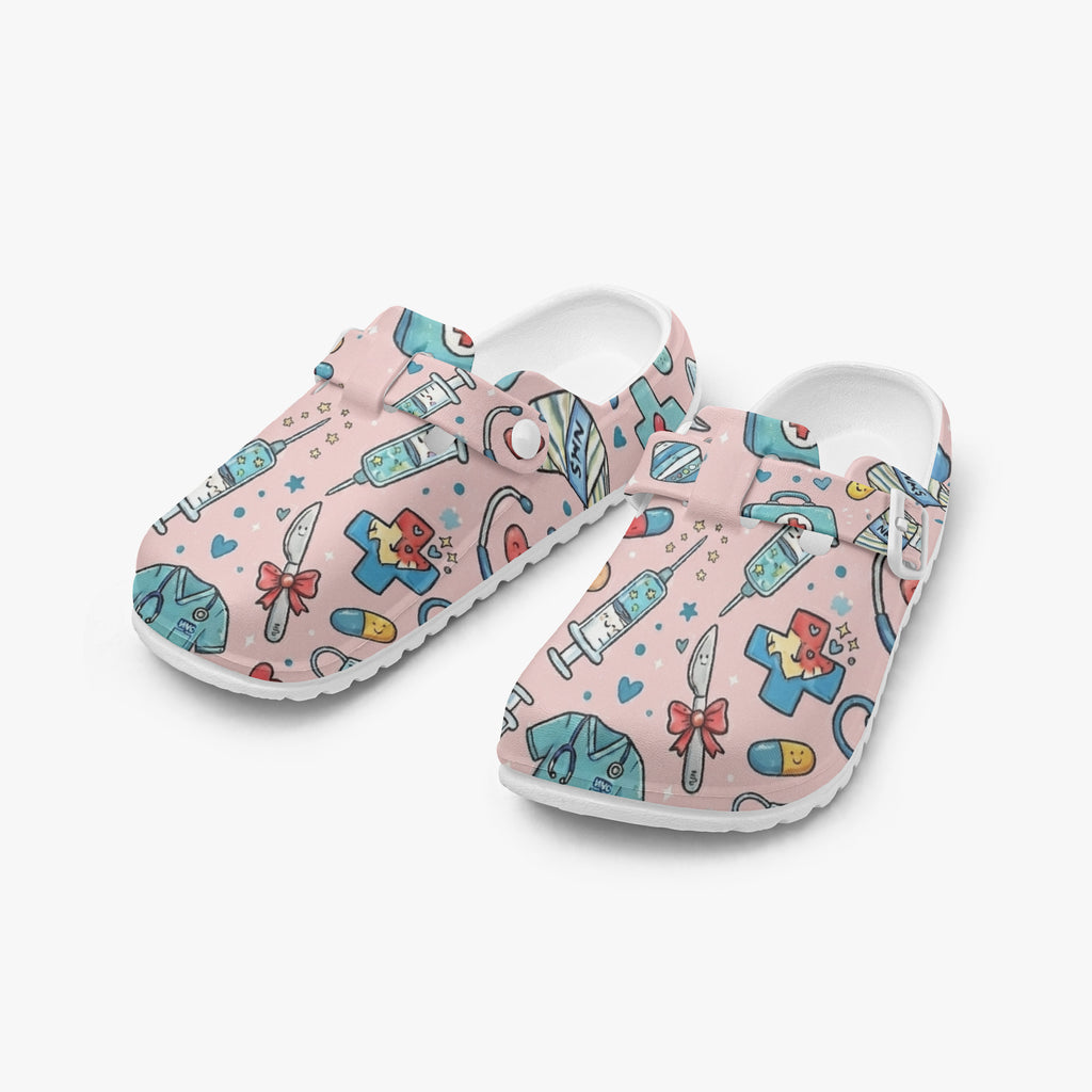 Pair of pink medical doodle clogs with open back, colorful cartoon print and white sole