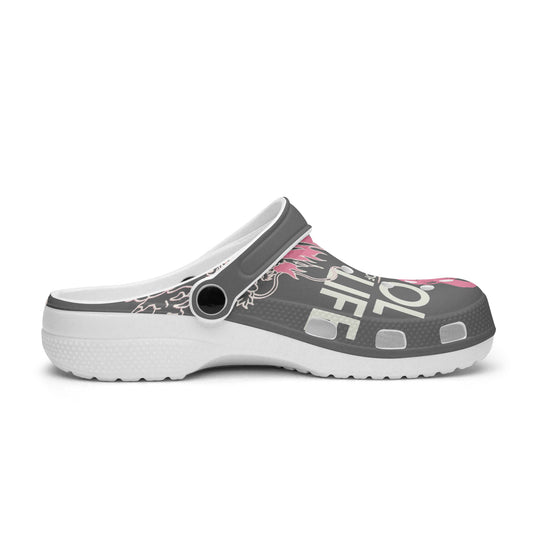 Dark gray slide clogs with pink graphic, round vent hole, and white platform sole