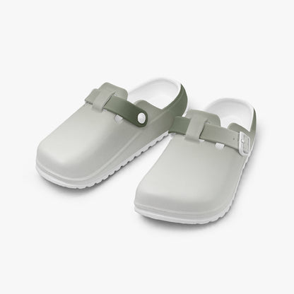 Pair of light gray EVA clogs with dark green accents and adjustable side straps