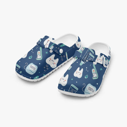 Pair of blue dental print clogs, slip-on EVA shoes with white interiors and cartoon pattern.