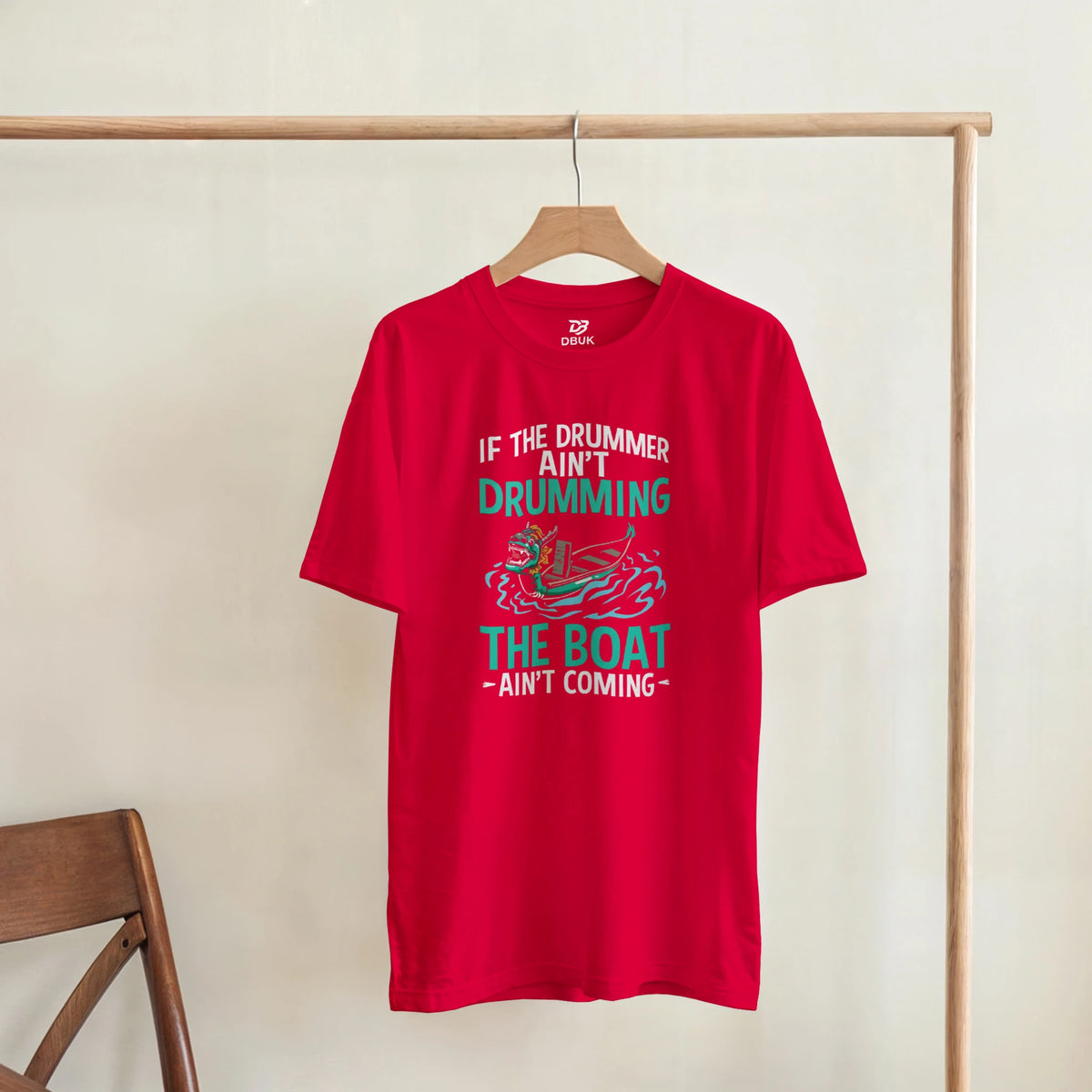 Red unisex graphic t-shirt hanging on wooden hanger