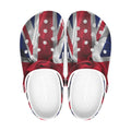 A pair of clog-style sandals with a Union Jack flag print on the upper and white footbeds, shown from a top-down view on a white background.