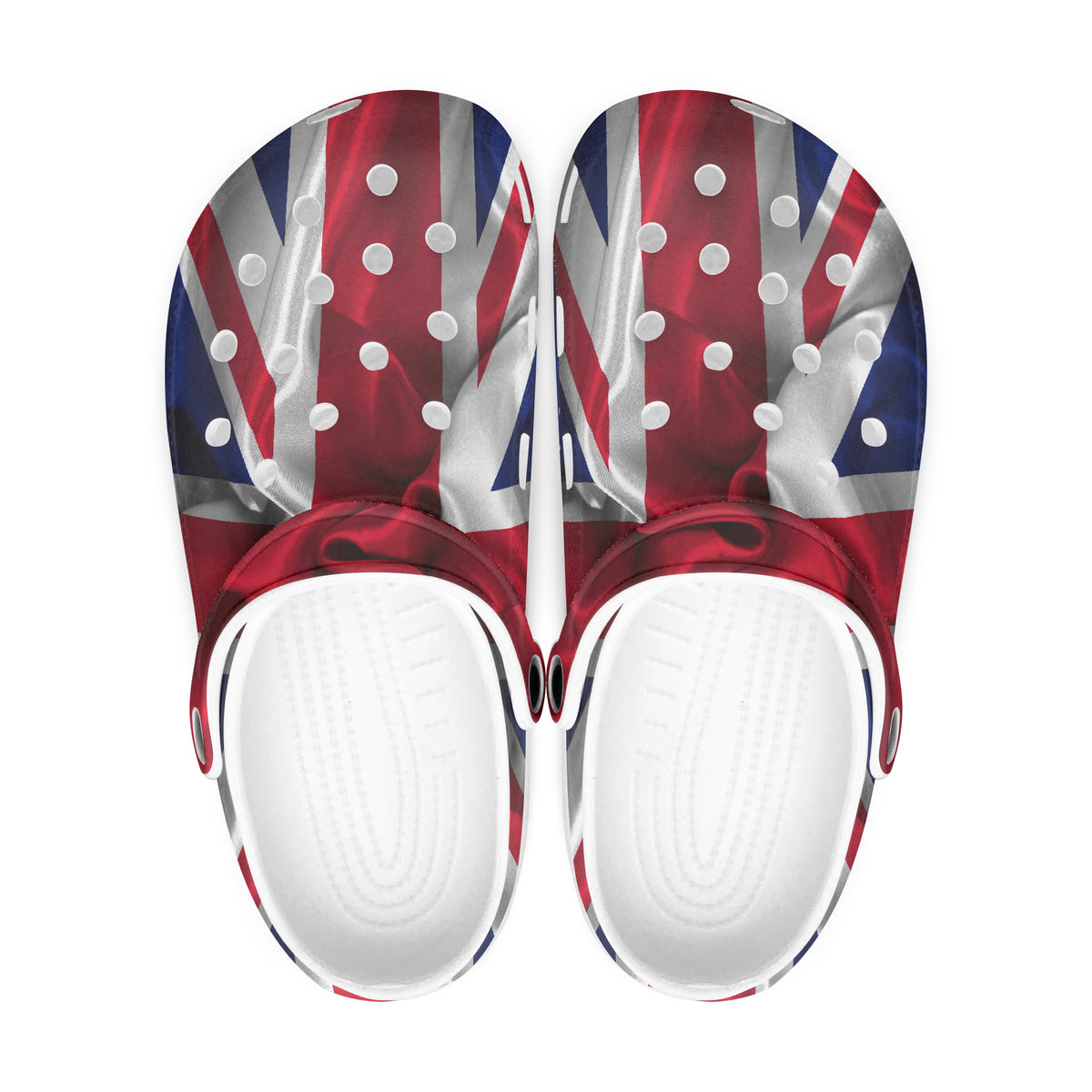 A pair of clog-style sandals with a Union Jack flag print on the upper and white footbeds, shown from a top-down view on a white background.