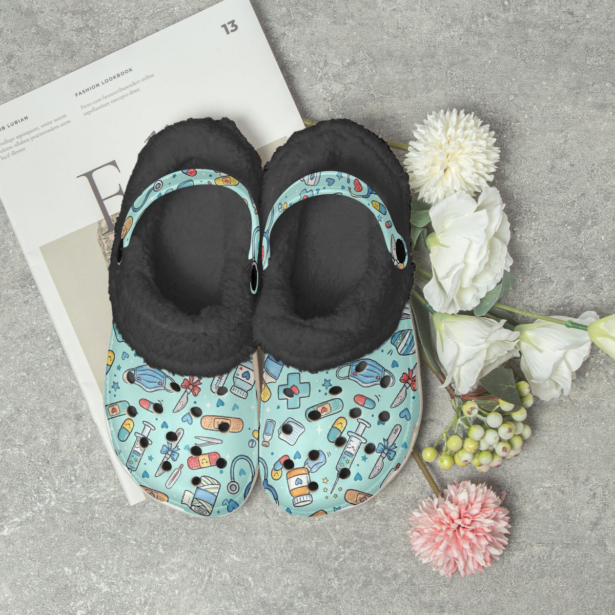 Pair of medical-cartoon lined slide slippers, dark interior and light blue print