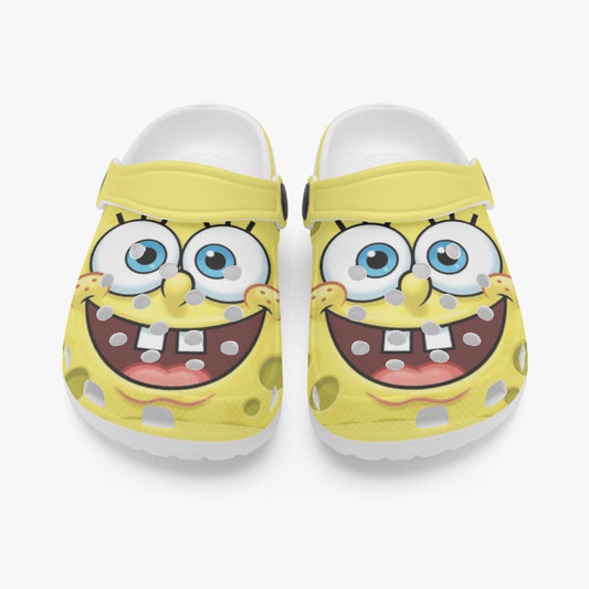 Kids yellow slip-on clogs with cartoon face design, showing front view