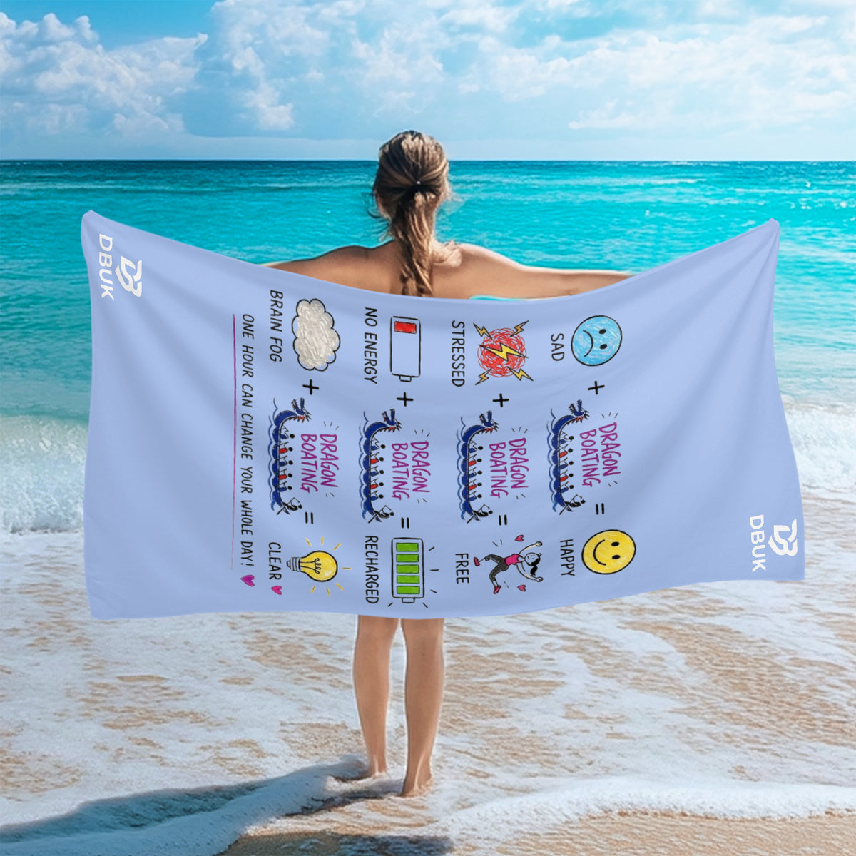 White beach towel held on shore with multicolor dragon boat cartoon graphic
