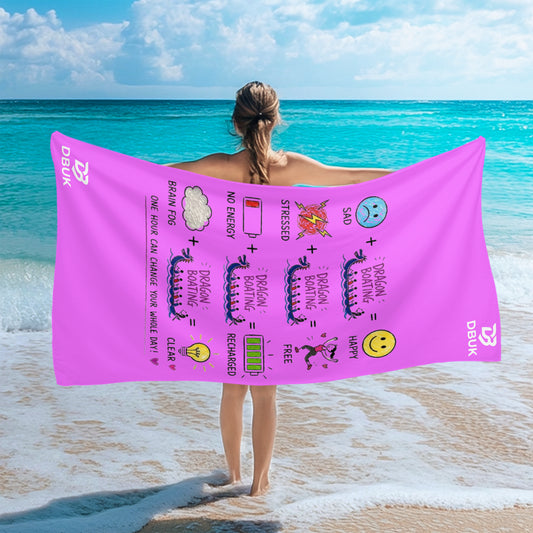 Pink beach towel with paddler cartoon text graphic, shown draped over person