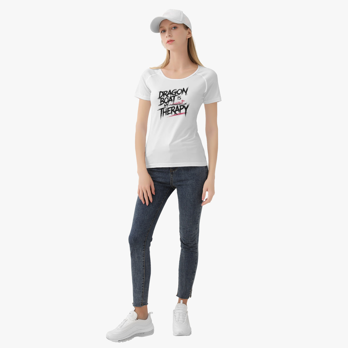 Women’s white graphic T-shirt with short sleeves, worn with jeans and cap