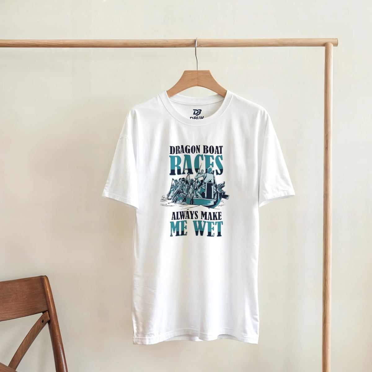 White unisex t-shirt with centered boat race graphic and text "ALWAYS MAKE ME WET"
